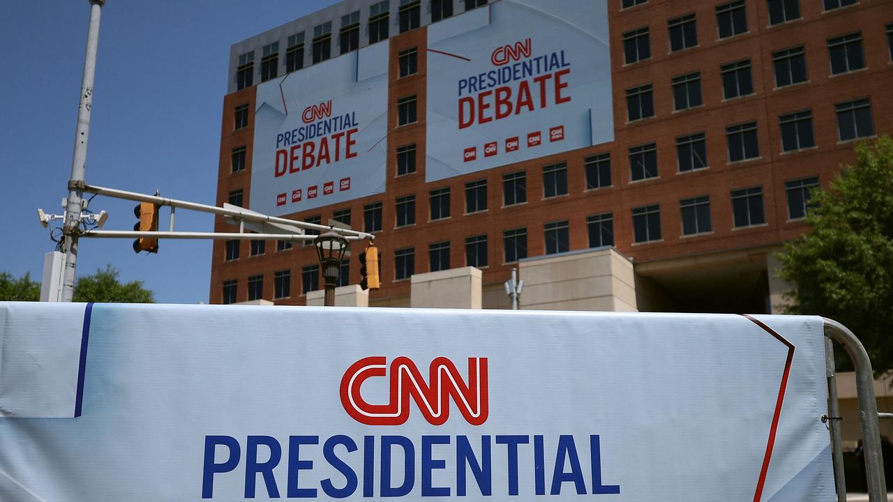 Signs for the CNN presidential debate are seen outside of the CNN studios in Atlanta, Geoirgia. Photo by JUSTIN SULLIVAN / GETTY IMAGES NORTH AMERICA / Getty Images via AFP.