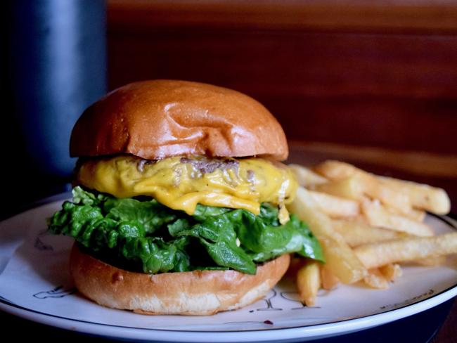 Paddo Inn’s popular cheeseburger with hot chips. Picture: Jenifer Jagielski