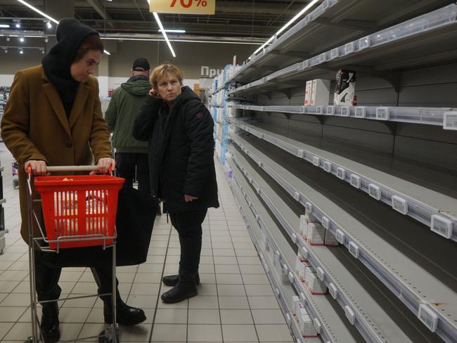 People look at empty shelves in the sanitary napkin section at a shopping mall in Moscow, Russia. Many worldwide brands have suspended any investment and sales in Russia over its military invasion on Ukraine. Picture: Getty Images