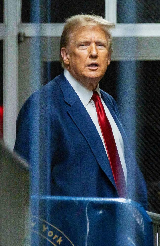 Donald Trump stands outside the courtroom after a hearing sets his trial for April 15, in the ongoing criminal case for alleged hush money payments tied to extramarital affairs. Picture: Justin Lane/AFP