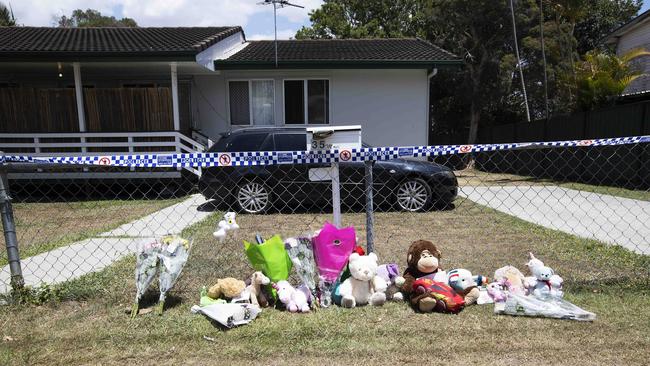 A memorial out the front of the house where the two little girls were found. Picture: AAP Image/Attila Csaszar