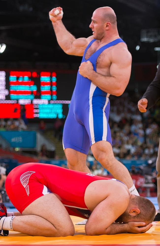 Artur Taymazov celebrates near devasted US wrestler Tervel Dlagnev at the 2012 Olympics. (David Eulitt/Kansas City Star/MCT via Getty Images)