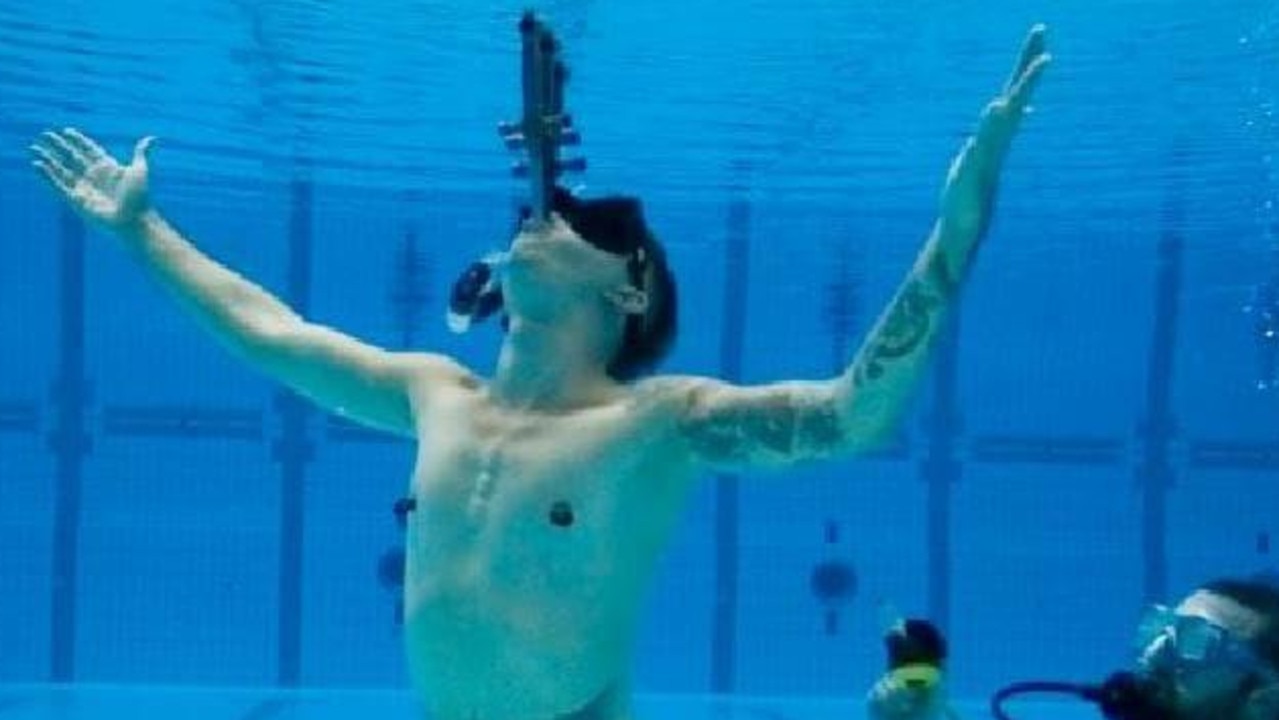 Space Cowboy completed the most underwater somersaults while sword swallowing. Picture: Guinness World Records