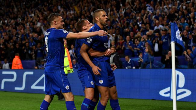 Islam Slimani of Leicester City (R) celebrates with team mates.