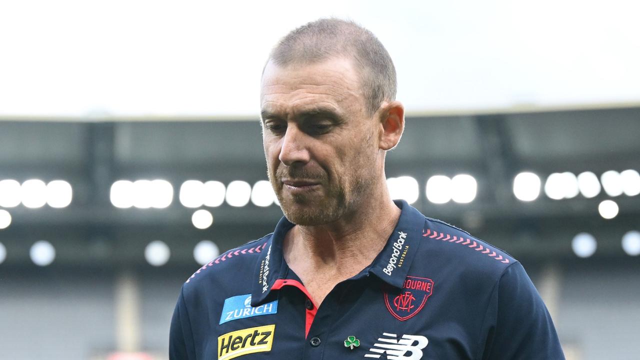 MELBOURNE, AUSTRALIA - MARCH 16: Clayton Oliver and Simon Goodwin of the Demons looks dejected after losing the round one AFL match between Melbourne Demons and GWS Giants at Melbourne Cricket Ground, on March 16, 2025, in Melbourne, Australia. (Photo by Quinn Rooney/Getty Images)