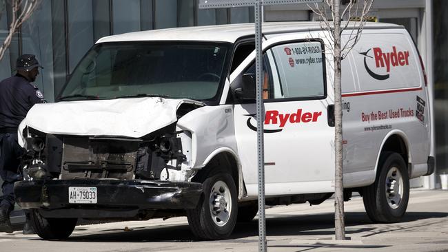 Police inspect a van suspected of being involved in the incident. Picture: AFP.