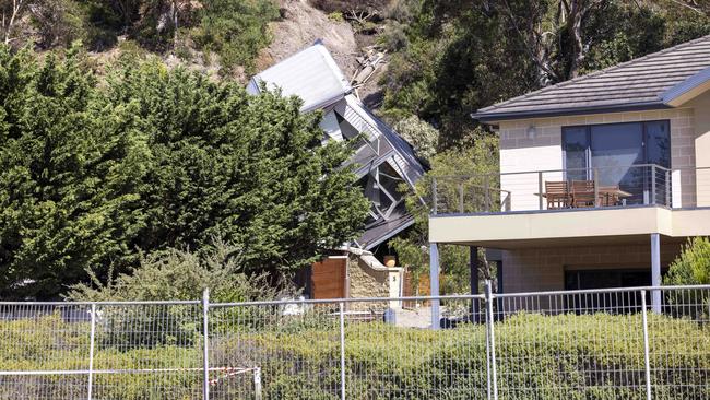 The site of the home impacted by the landslide remains fenced off. Picture: Wayne Taylor