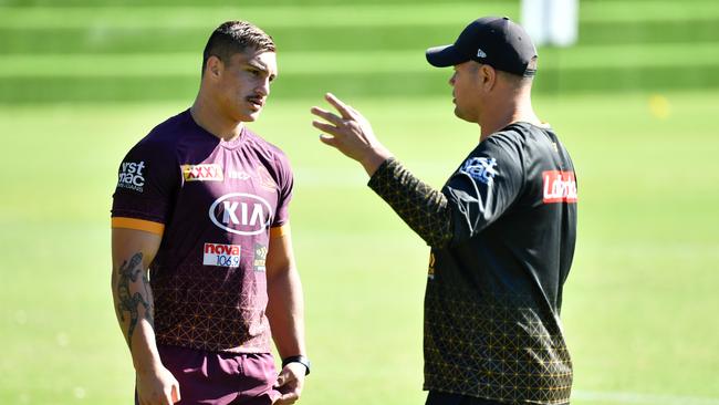 Kotoni Staggs (L) talks with Brisbane Broncos coach Anthony Seibold. Picture: AAP