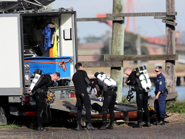 Police divers at the scene on Tuesday. Picture: Peter Lorimer