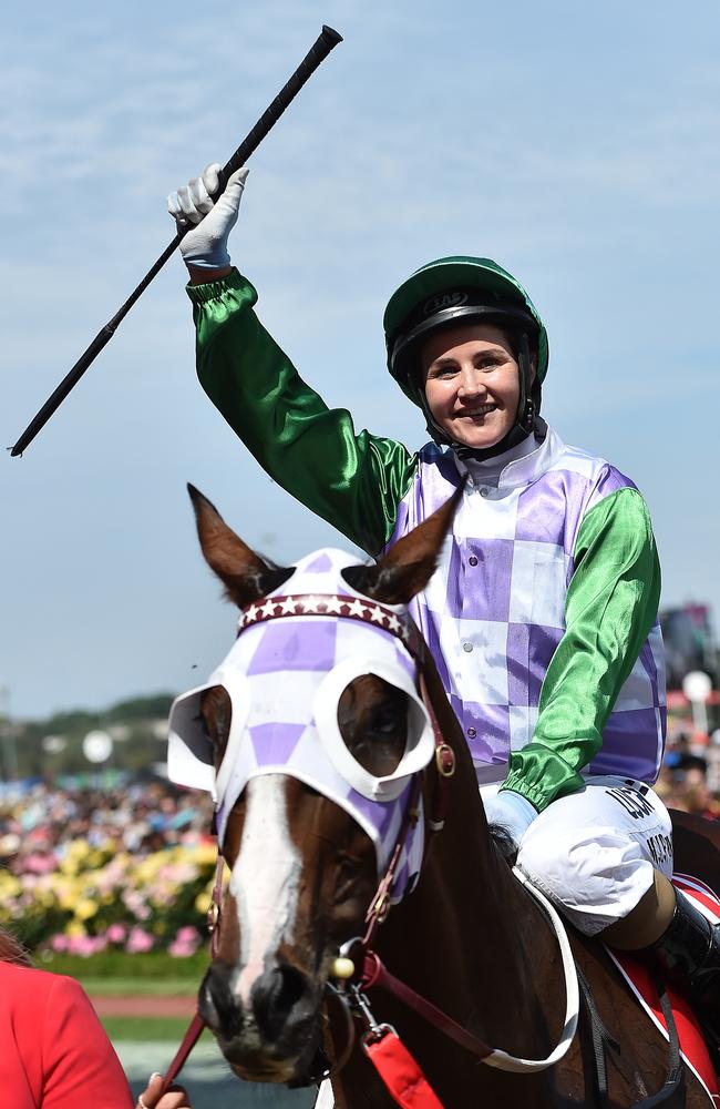 Michelle Payne salutes the crowd after her stunning win on Prince of Penzance.