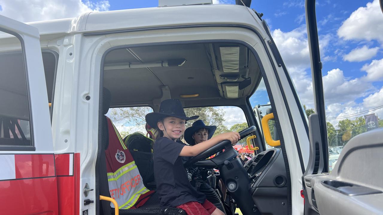 Chevy and Nova got a chance to sit in the fire truck at the Fire + Rescue NSW truck stand at the Murwillumbah show. Picture: David Bonaddio