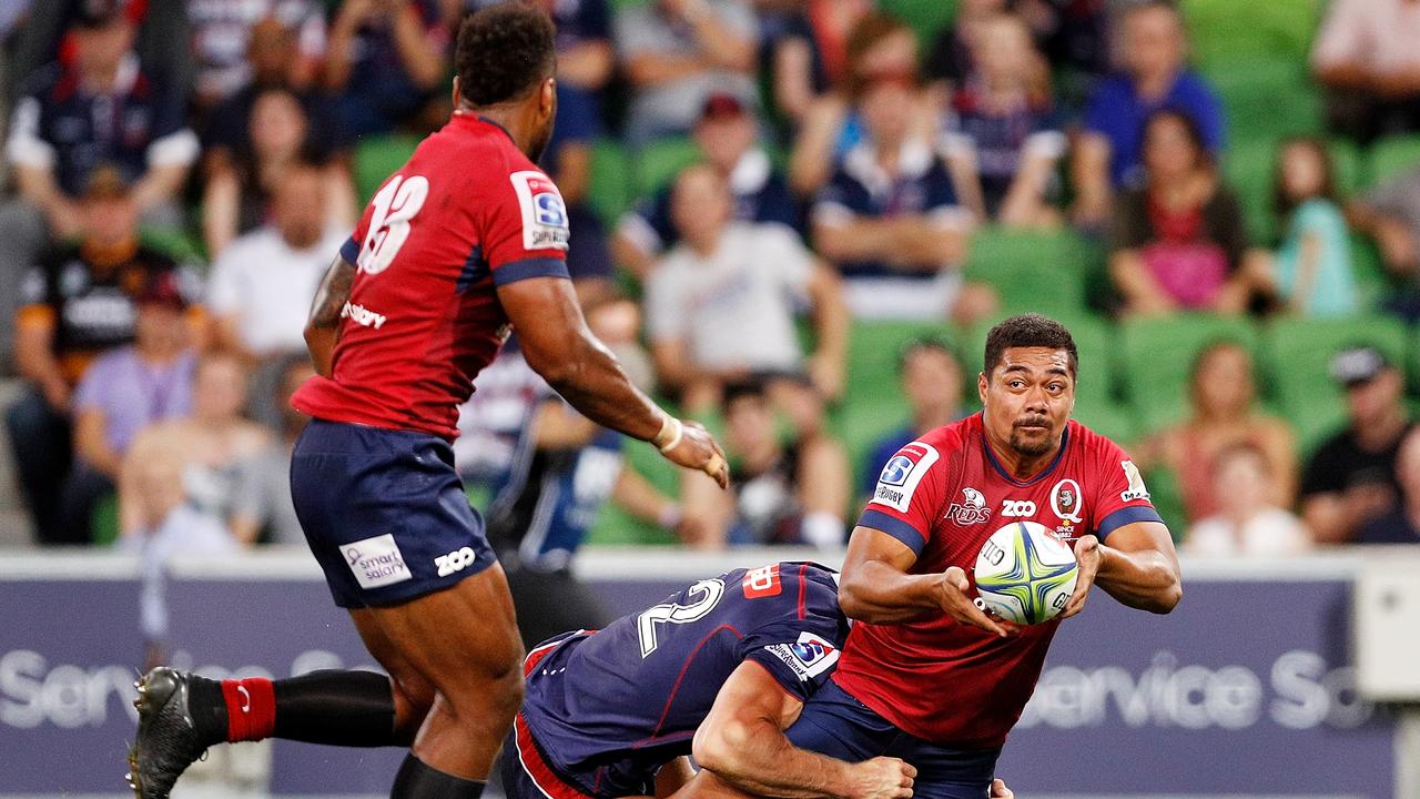 Chris Feauai-Sautia of the Reds passes the ball to Samu Kerevi.