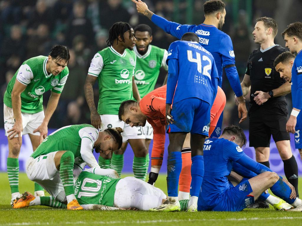 Martin Boyle (10) is checked on by concerned players after hitting his head on the turf. Picture: Ross Parker/SNS Group via Getty Images