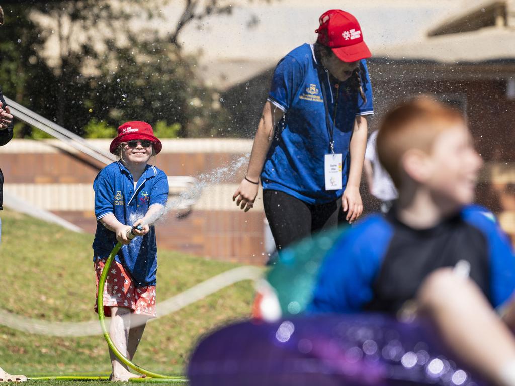 Charlotte sprays Fairholme College student Sophie Wise as Toowoomba Grammar School hosts the Sony Foundation Children’s Holiday Camp, Monday, September 16, 2024. Picture: Kevin Farmer