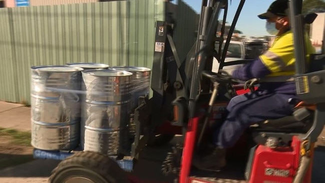 Police remove drums of Butanediol. Picture: Supplied