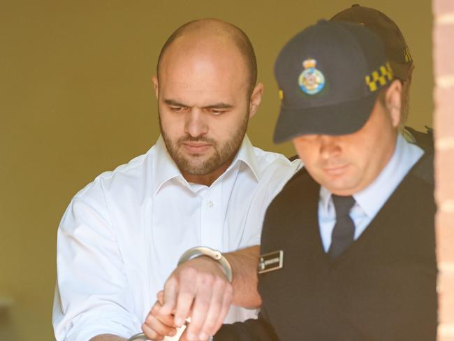 Murderer Vincent Stanford is taken from Griffith Court after his sentencing to life. Picture: Michael Frogley.