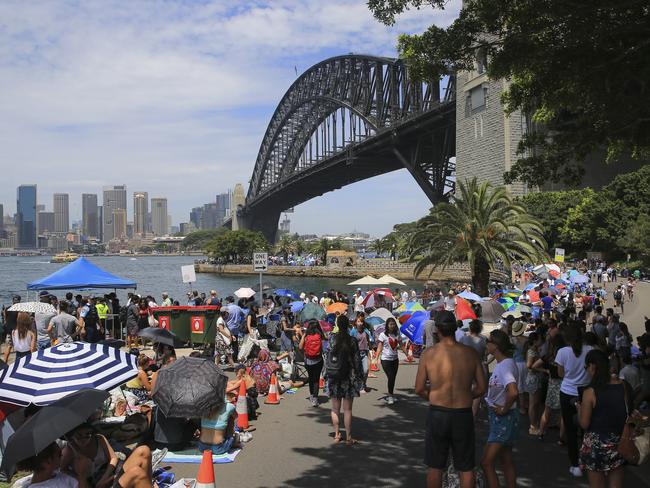 People settling in at Milsons Point for tonight's New Years Eve celebrations in Sydney. Picture: Dylan Robinson