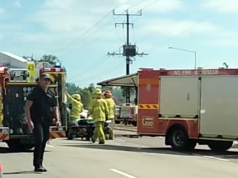 Emergency services on the scene of a crash between a car and a truck on the Stuart Hwy in Pinelands. Picture: Michael Labura