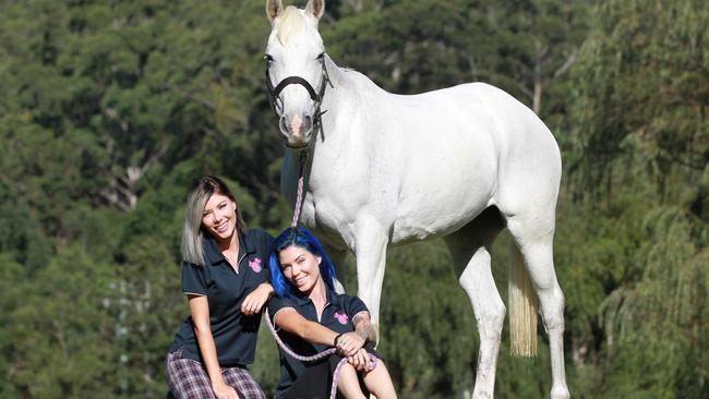 Gold Coast DJ twins, Brooke and Ellie Kelaart, founders of Project Ponies, a rescue and rehabilitation program for ill-treated horses destined for slaughter. Pictured with rescued horse Sadie. Picture: Mike Batterham