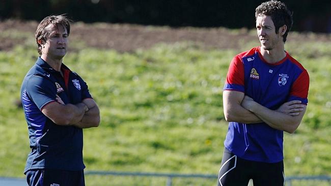 Injured skipper Robert Murphy (right) talks with coach Luke Beveridge. Picture: Michael Klein