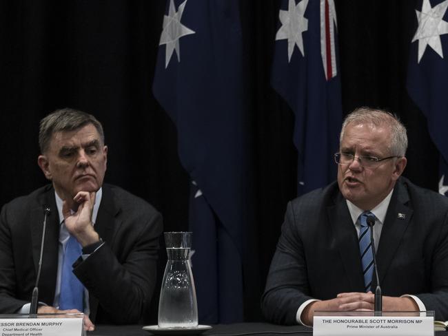 SYDNEY, AUSTRALIA - MARCH 13: (L-R) Professor Brendon Murphy, Prime Minister Scott Morrison and Gladys Berejiklian are pictured during a press conference announcing the recommendation that all mass gatherings of 500 people `or more are cancelled from Monday 16th of March. The government is also recommending against all overseas travel. The press conference followed the Council of Australian Governments (COAG) meeting on 13th of March, 2020 in Sydney, Australia. The usual agenda for the state, territory and local government leaders has been set aside to discuss measures to stop further spreading of COVID-19 in Australia. (Photo by Brook Mitchell/Getty Images)