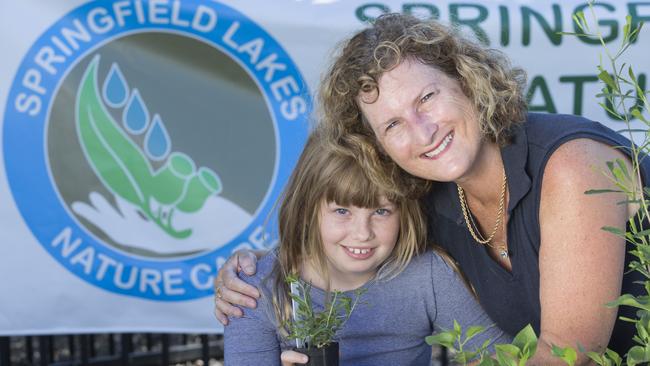 President of Springfield Lakes Nature Care Luise Manning with her daughter Abbeny. Picture: AAP/Renae Droop