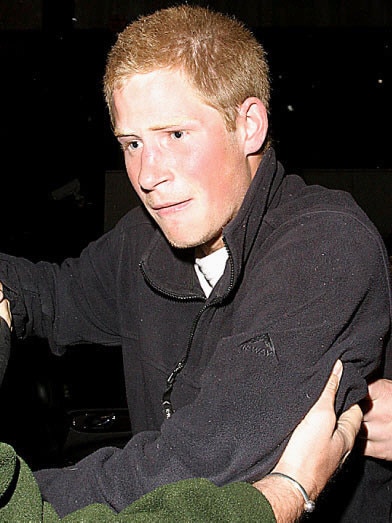 Harry clashes with a photographer outside Pangaea nightclub club in London.