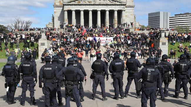 Protesters face off with police at the Shrine of Remembrance in Melbourne last Wednesday. Picture: David Crosling