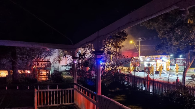 Firefighters work to put out a fire at Poppys Takeaway shop in Brassall early on Thursday morning. Photo: Kayley Giboulot