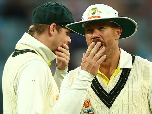 ADELAIDE, AUSTRALIA - DECEMBER 09:  David Warner and Steve Smith of Australia look on during day two of the Second Test Match in the series between Australia and the West Indies at Adelaide Oval on December 09, 2022 in Adelaide, Australia. (Photo by Chris Hyde/Getty Images)