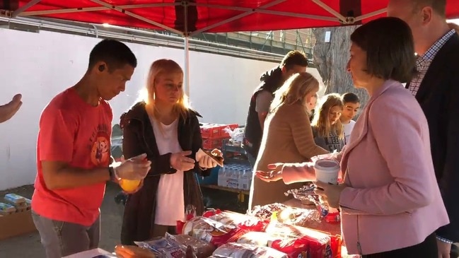 Premier Gladys Berejiklian buys democracy sausage