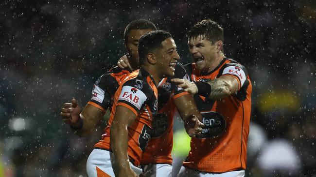 Wests Tigers players celabrate a try against the Panthers. Picture: NRL Photos