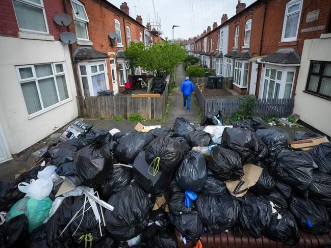 BIRMINGHAM, ENGLAND - APRIL 15: Uncollected household waste and rubbish blights Primrose Avenue, in Sparkbrook, as Birmingham council refuse collectors continue their strike on April 15, 2025 in Birmingham, England. On Monday union members voted to reject a council offer to end the refuse workers' strike, as the government announced it had called on office-based military personnel to help the council clear rubbish from Birmingham's streets. Rubbish collectors and members of Unite began intermittent strikes earlier this year over Birmingham City Council's plans to downgrade some staff and reduce their pay, and on March 11 refuse workers declared an indefinite strike after the council's move to use agency staff for bin collections. A major incident has been declared in the city, as uncollected rubbish continues to pile up and case rat infestation.  (Photo by Christopher Furlong/Getty Images) *** BESTPIX ***