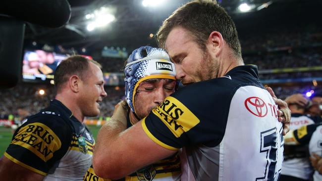 Johnathan Thurston and Gavin Cooper embrace after the 2015 Grand Final. Picture: Brett Costello