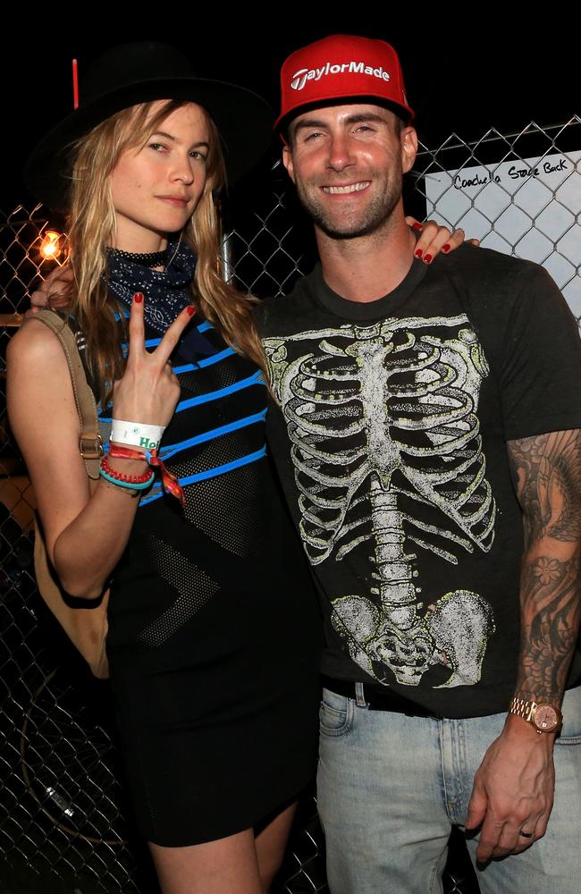 The beautiful people ... model Behati Prinsloo and musician Adam Levine pictured at the Empire Polo Club as part of Caochella. Picture: Christopher Polk/Getty Images for Coachella