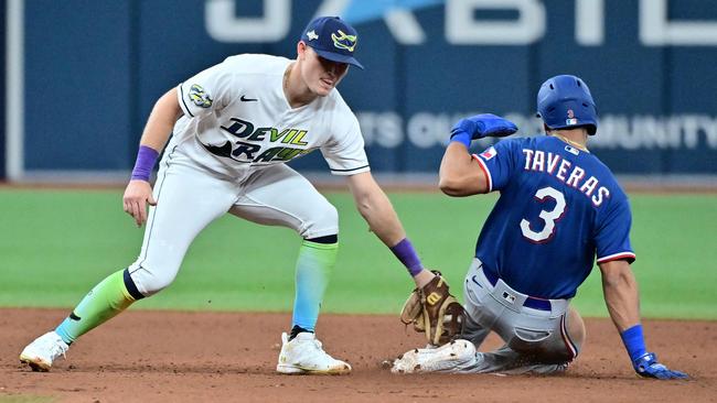 ST PETERSBURG, FLORIDA - OCTOBER 03: Curtis Mead #25 of the Tampa Bay Rays tags Leody Taveras #3 of the Texas Rangers out on an attempted steal in the ninth inning during Game One of the Wild Card Series at Tropicana Field on October 03, 2023 in St Petersburg, Florida.   Julio Aguilar/Getty Images/AFP (Photo by Julio Aguilar / GETTY IMAGES NORTH AMERICA / Getty Images via AFP)