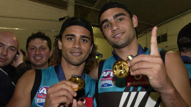 The Burgoyne boys, Peter and Shaun show off their 2004 premiership medals.