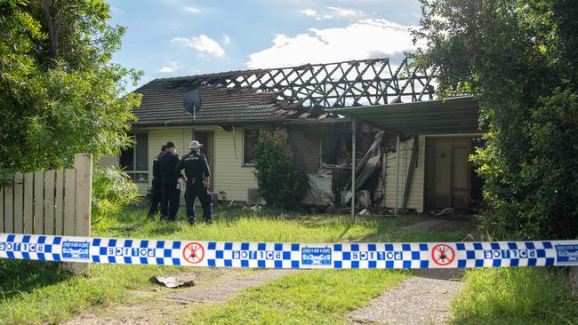 Police and Fire Investigators at the scene of a house fire in Rowe Terrace, Darra where the body of woman was found. PICTURE: Brad Fleet