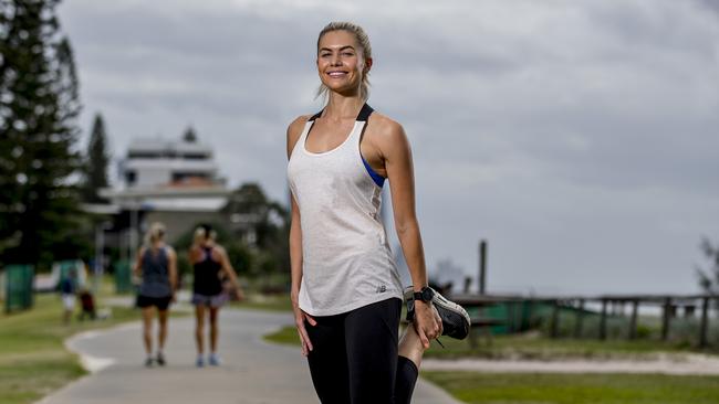 Gold Coast Marathon ambassador Dani Byrnes is warming up before training for this year’s event on 7 July. Picture: Jerad Williams