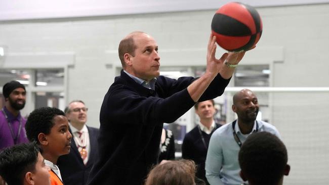 The Prince of Wales throws a basketball during a visit to WEST, the new OnSide Youth Zone in Hammersmith and Fulham in London. Picture: AFP