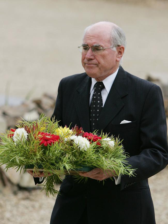 Australian Prime Minister John Howard lays a wreath at the memorial site of the Port Arthur massacre on the 10th anniversary. Picture: AAP/Getty