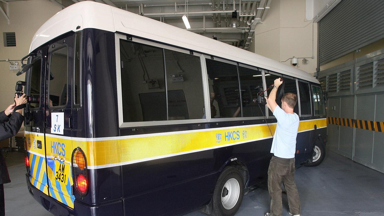 Photographers swoop as CV, Diaz and Tran arrive on a Hong Kong Correctional Services prison van to the Hong Kong High Court for a hearing in 2006.