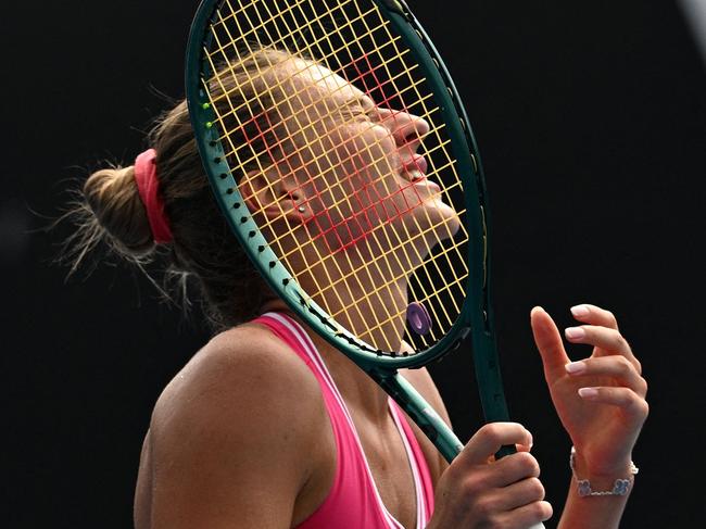 Ukraine's Marta Kostyuk reacts after a point against Russia's Elina Avanesyan during their women's singles match on day six of the Australian Open tennis tournament in Melbourne on January 19, 2024. (Photo by Anthony WALLACE / AFP) / -- IMAGE RESTRICTED TO EDITORIAL USE - STRICTLY NO COMMERCIAL USE --