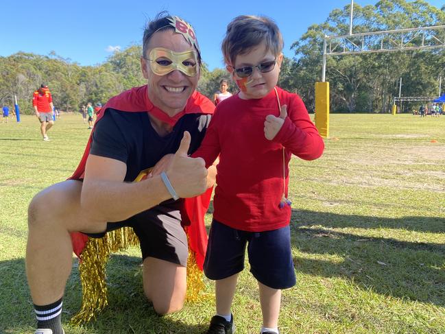 Luke Kenelley, Deputy Principal of Musgrave Hill State School, with Slater Clifton-Walker on his Hero Day fundraiser for brain cancer research.