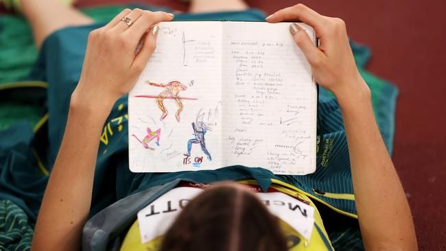 McDermott and her special journal where she writes words of inspiration as well as rating every jump during the competition. Picture: Getty Images