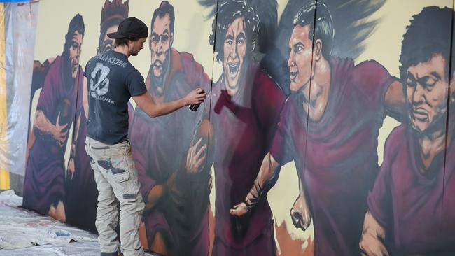 Bohdi Gardner works on his mural. Picture: Annette Dew