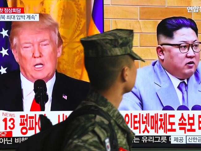 The Twitter rhetoric of US President Donald Trump (L) has inflamed tensions with North Korea. Picture: AFP/Jung Yeon-je