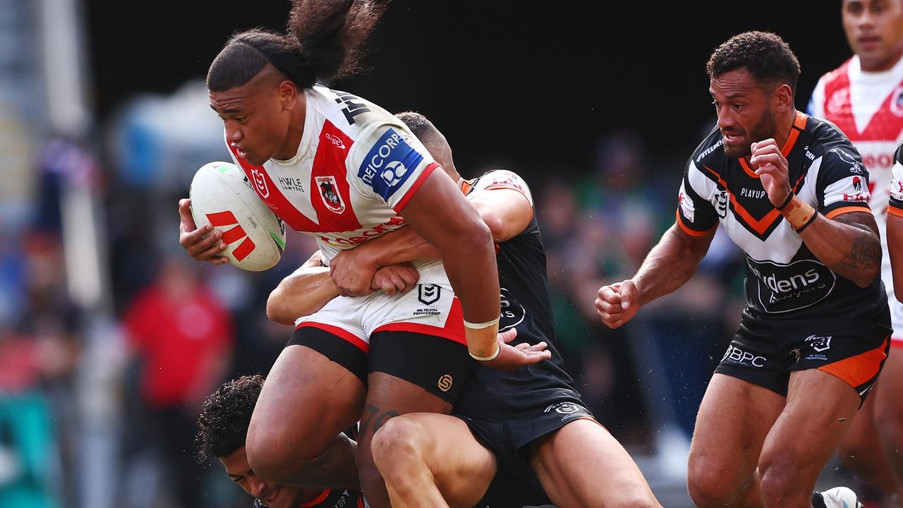 BRISBANE, AUSTRALIA - MAY 07: Moses Suli of the Dragons is tackled during the round 10 NRL match between Wests Tigers and St George Illawarra Dragons at Suncorp Stadium on May 07, 2023 in Brisbane, Australia. (Photo by Chris Hyde/Getty Images)