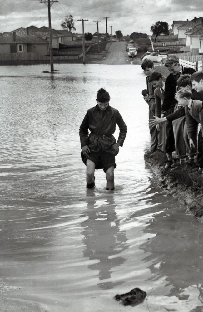 In 1955, schoolboys brave floodwaters in Jordanville. Picture: Frank Grant/ARGUS COLLECTION