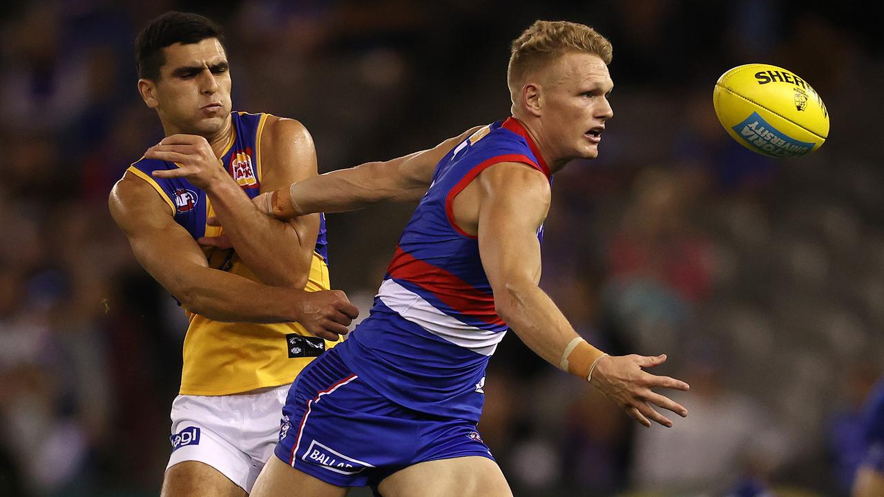 Adam Treloar wins the ball under pressure from Tom Cole. Picture: Michael Klein